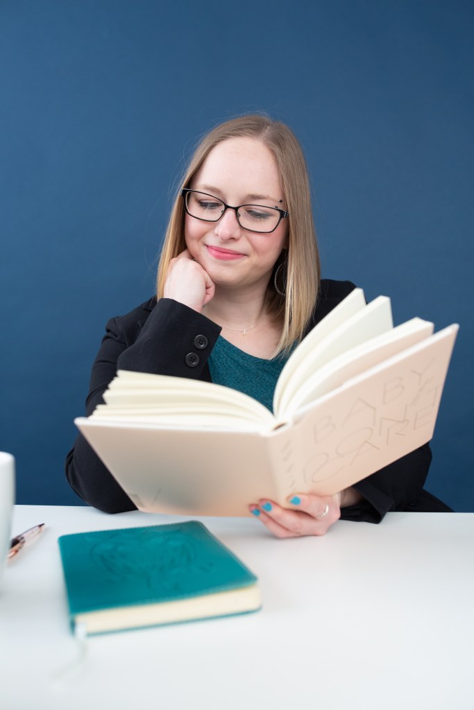 Kelsey Hoff content writer with book