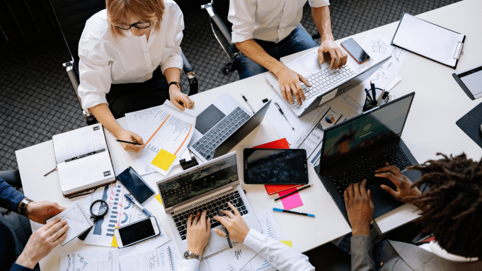 Diverse team working at table